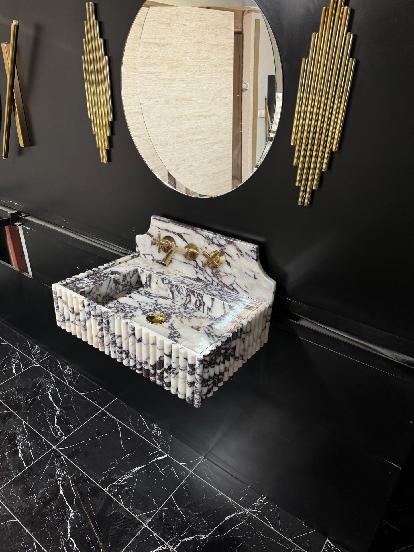 Full Ribbed Calacatta Viola Marble Sink, featuring fluted detailing on all sides for a bold architectural look. Handcrafted from premium Viola marble, this floating rectangular basin is paired with a custom Calacatta marble backsplash, creating a harmonious, luxury aesthetic