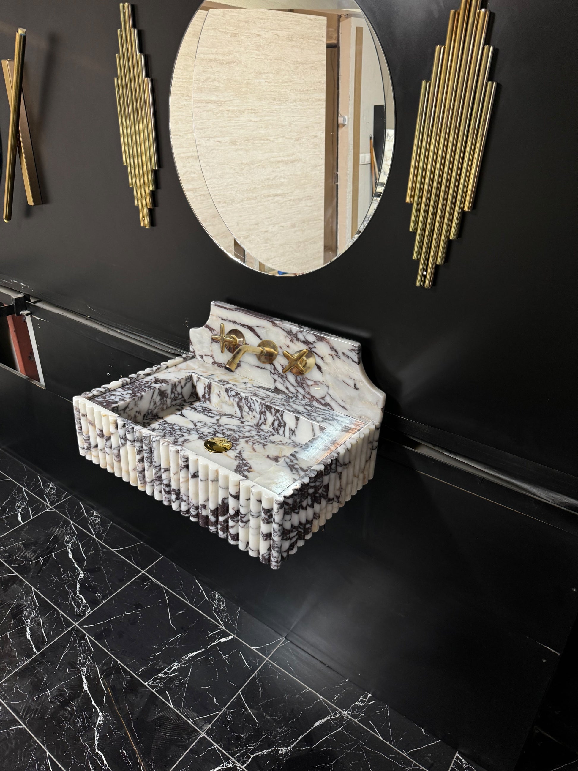 Full Ribbed Calacatta Viola Marble Sink, featuring fluted detailing on all sides for a bold architectural look. Handcrafted from premium Viola marble, this floating rectangular basin is paired with a custom Calacatta marble backsplash, creating a harmonious, luxury aesthetic